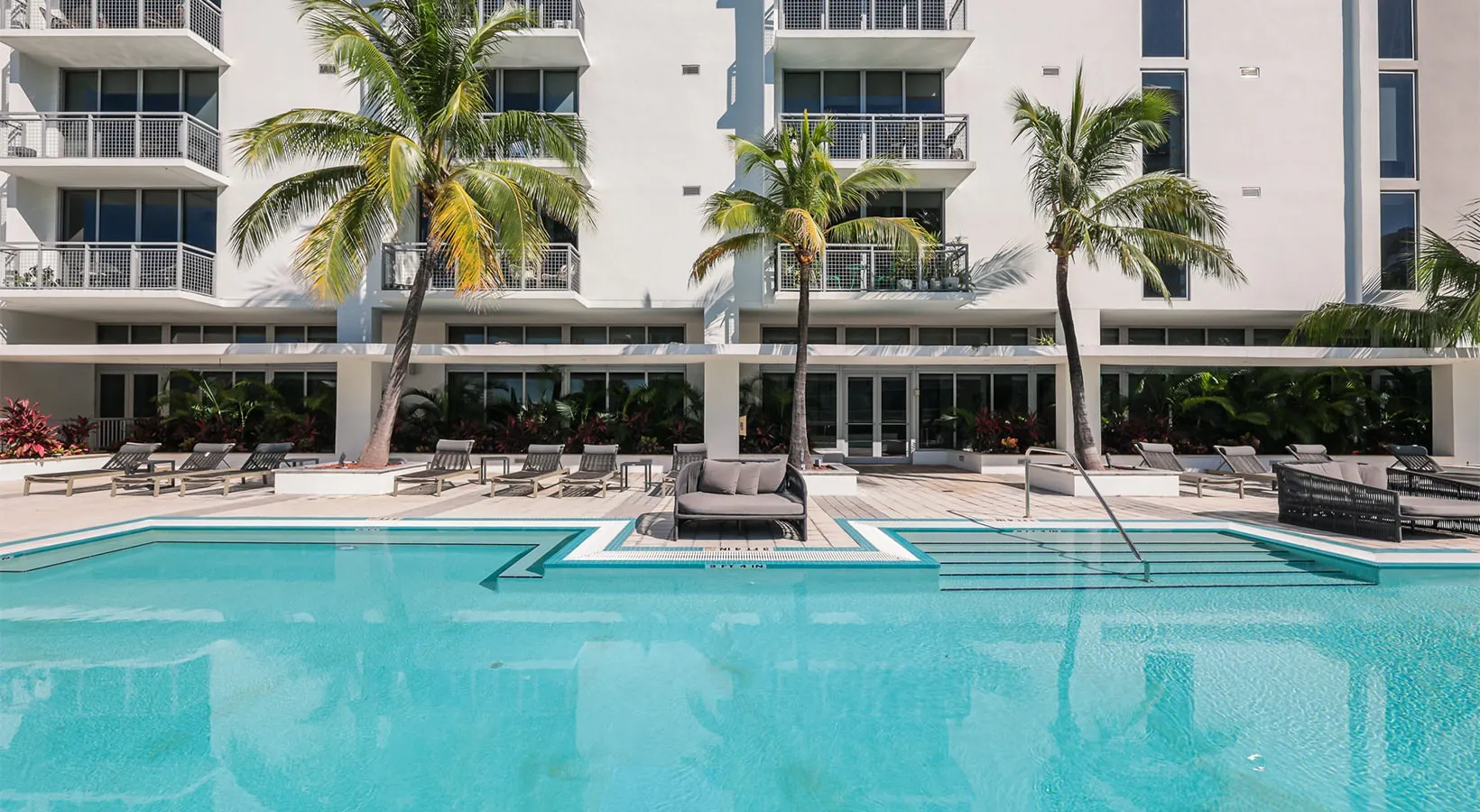 Expansive pool deck with comfortable lounging